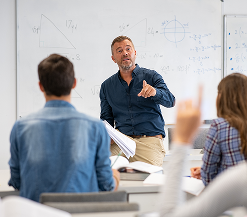 Male Teacher answering a question to a student